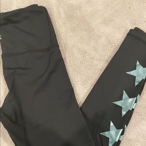 Black strut this leggings with metallic blue stars on the bottom! One size